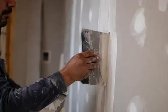 Drywall taping and finishing in progress